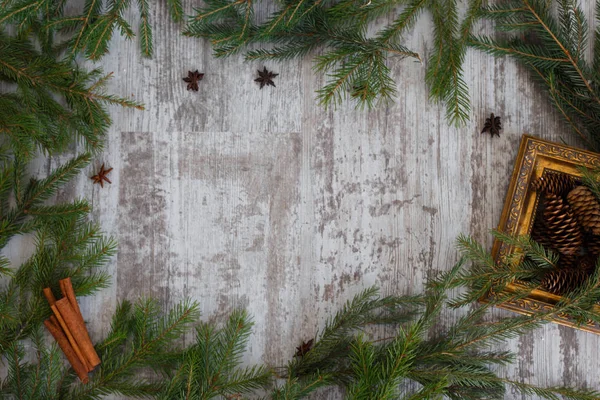 Christmas Composition Fir Branches Fir Cones Gilded Frame Cinnamon Anise — Stock Photo, Image