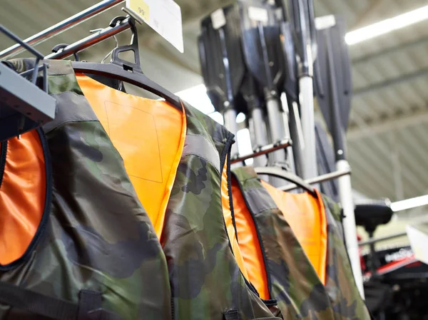 Life jackets for fishing in sport shop — Stock Photo, Image