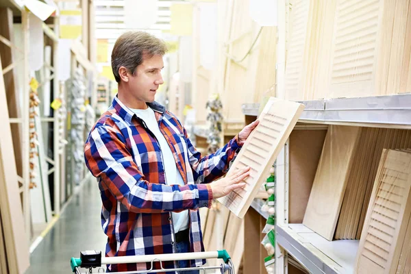 Man Chooses Wooden Facades Furniture Store Construction Materials — Stock Photo, Image
