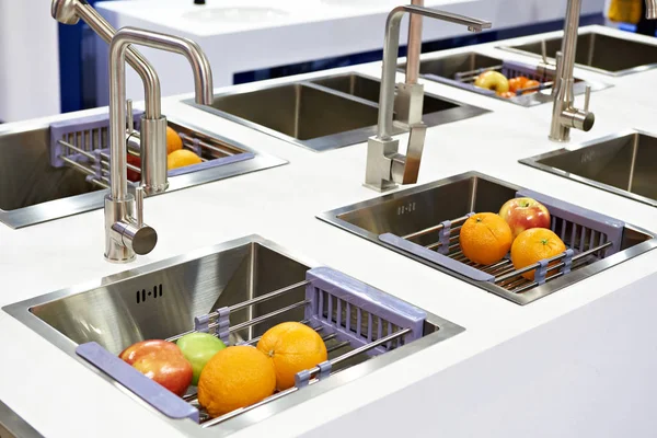 Kitchen water taps with fruits — Stock Photo, Image