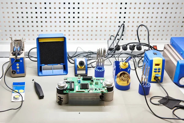 Workplace with soldering iron and tool for electronic — ストック写真