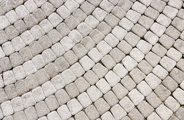 Шаблон на каменном тротуаре в качестве фона — стоковое фото