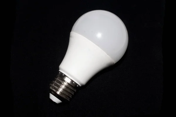 Light bulb isolated on black background — Stock Photo, Image