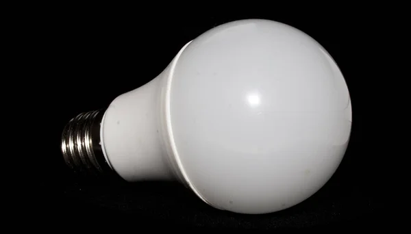 Light bulb isolated on black background — Stock Photo, Image