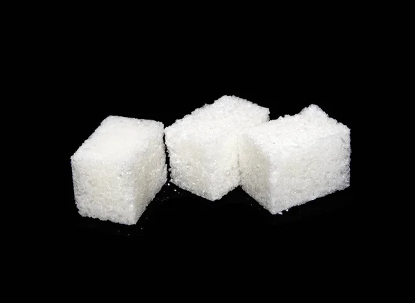 Sugar isolated on black background — Stock Photo, Image