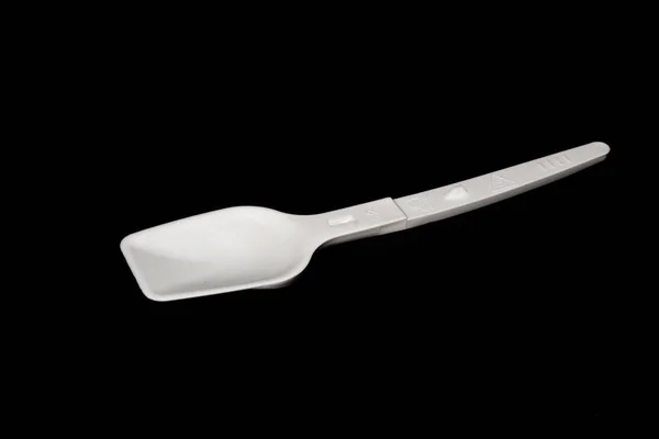 Spoon isolated on a black background — ストック写真