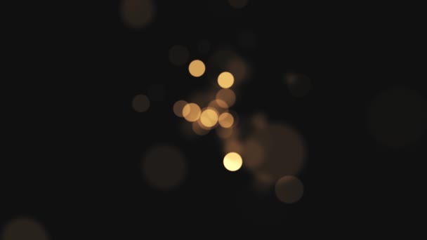 Abstract background with shining bokeh sparkles. Smooth animation looped. Abstract golden bokeh particles seamless loop — Stock Video