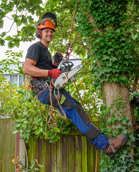 Smiling Tree Surgeon with chainsaw