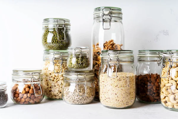 Frascos Vidrio Con Varios Frutos Secos Frijoles Semillas Sobre Fondo — Foto de Stock