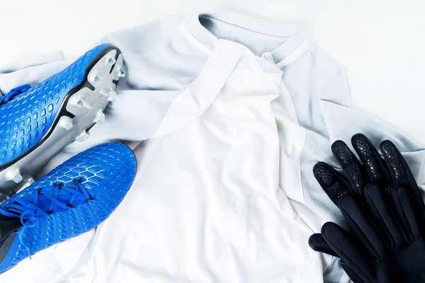 Blue football soccer boots cleats shoes and gloves on white t-shirt uniform