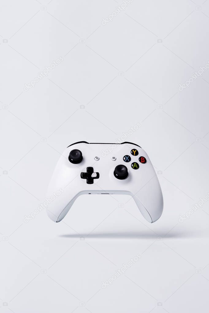 Creative Minimal Gaming concept with controller joystick on white background