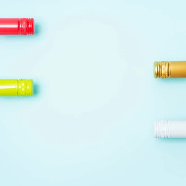 Download Screw Bottle Foil Caps In Different Bright Colors Of White And Rose Wine Bottles On Blue Background With Copy Space Minimal Abstract Colorful Mockup Concept Of Alcohol Beverage Flat Lay Stock
