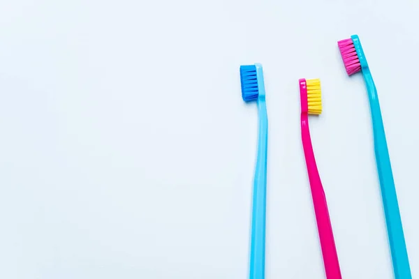 Colorful Toothbrushes Bright Color Bristles Light Pastel Blue Background — Stock Photo, Image
