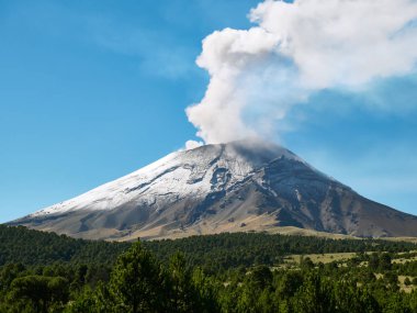 Fumarole comes out from the crater Popocatepetl volcano seen from Itza-Popo National Park, Mexico clipart