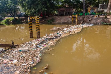 The extreme pollution of the Siem Reap River clipart