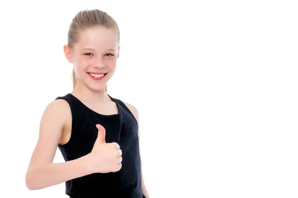 Niña sosteniendo su pulgar hacia arriba — Foto de Stock