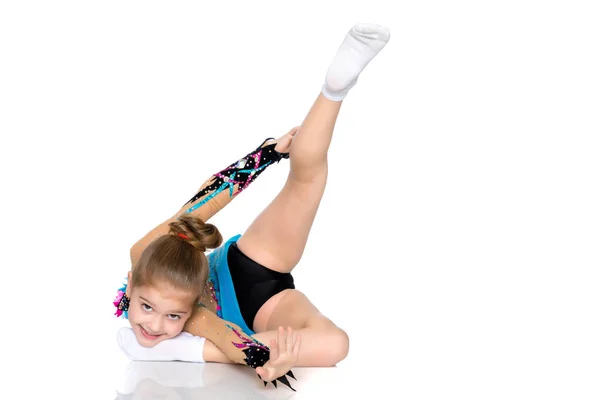 The gymnast perform an acrobatic element on the floor. — Stock Photo, Image