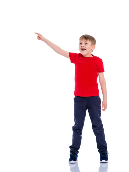 The boy points a finger at something. — Stock Photo, Image