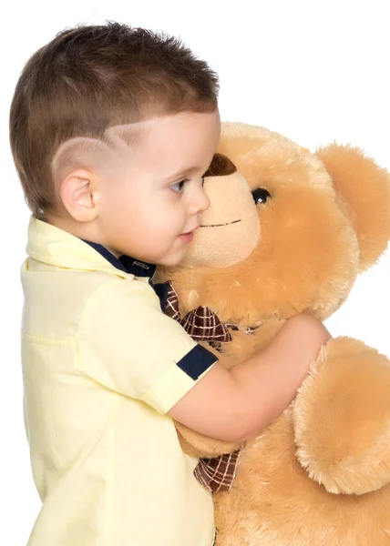 Little boy playing with teddy bear — Stock Photo, Image