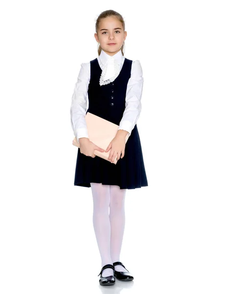 Hermosa niña en uniforme escolar . —  Fotos de Stock