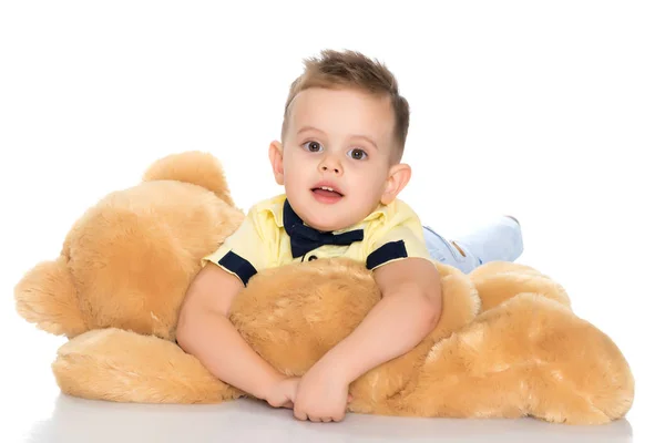 Little boy playing with teddy bear — Stock Photo, Image