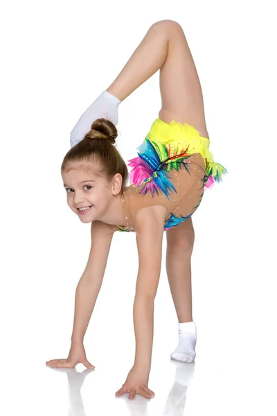 The gymnast balances on one leg. — Stock Photo, Image