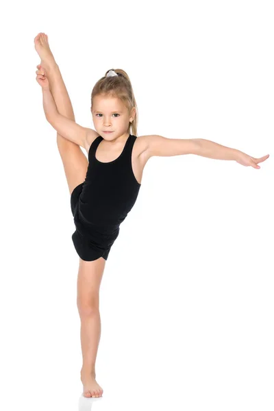 La gimnasta se equilibra en una pierna . —  Fotos de Stock