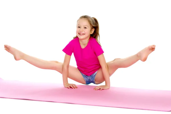 The gymnast perform an acrobatic element on the floor. — Stock Photo, Image