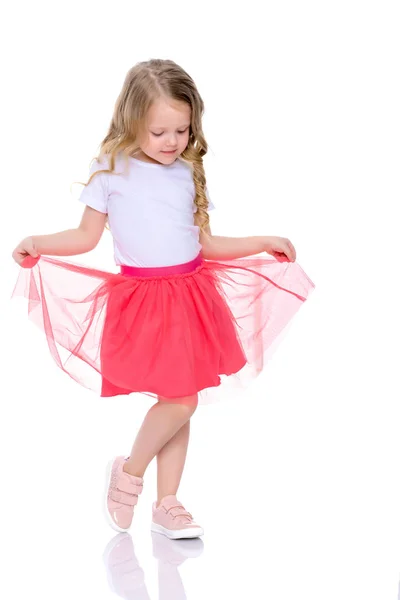 A cheerful little girl is dancing. — Stock Photo, Image