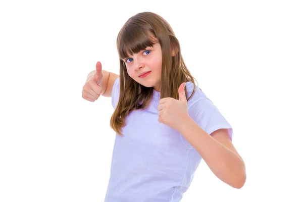 Niña sosteniendo su pulgar hacia arriba — Foto de Stock