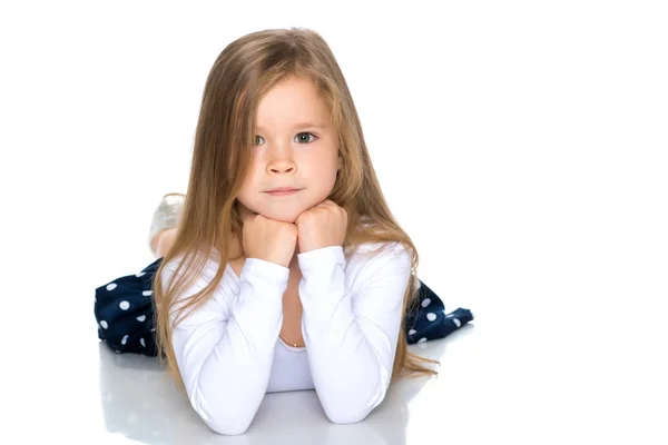 Little girl lies on the floor — Stock Photo, Image