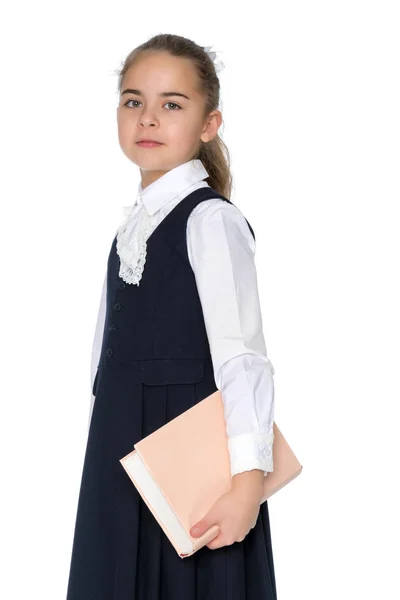 Girl schoolgirl with book. — Stock Photo, Image