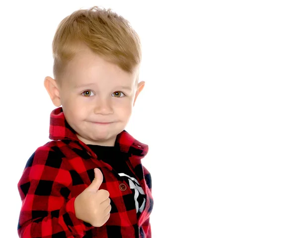 Un niño está levantando un dedo . —  Fotos de Stock