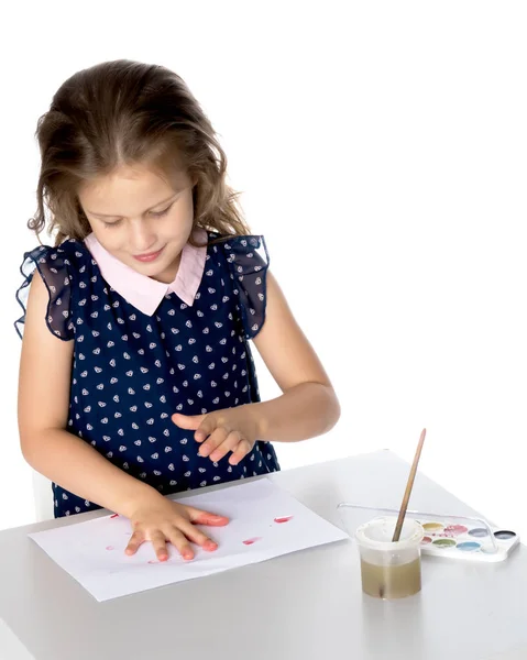 The little girl got dirty with the paints. — Stock Photo, Image