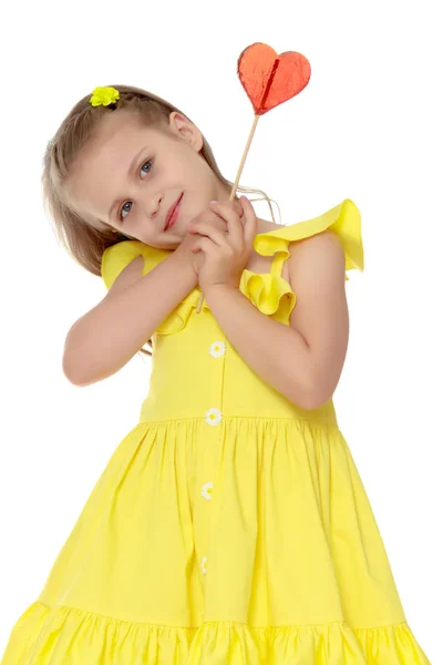 Little girl with a candy on a stick — Stock Photo, Image