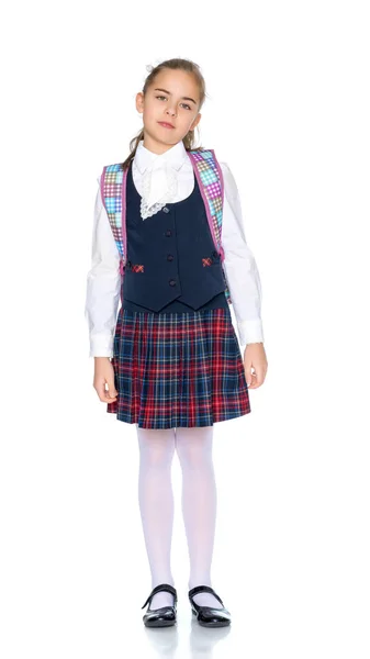 Schönes kleines Mädchen in Schuluniform. — Stockfoto