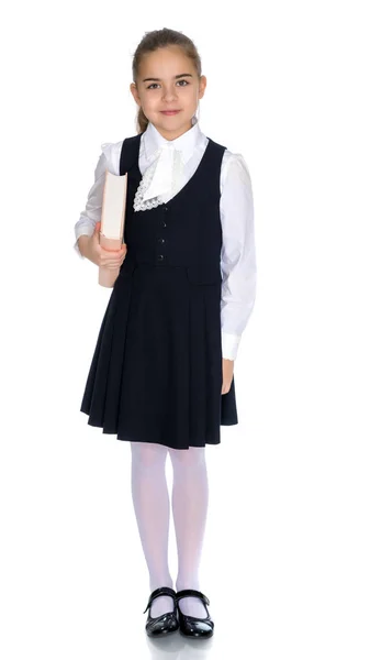 Girl schoolgirl with book. — Stock Photo, Image