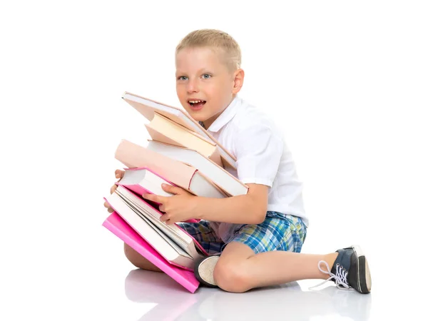Egy kisfiú, könyvek. — Stock Fotó