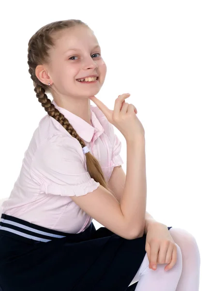 Klein meisje wijst met een vinger — Stockfoto