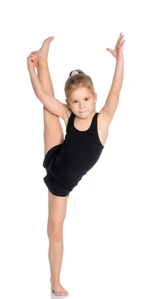 La gimnasta se equilibra en una pierna . —  Fotos de Stock