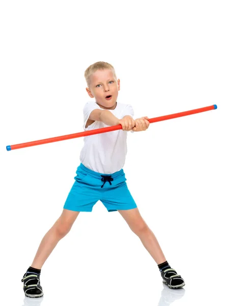 A little boy in a clean white T-shirt is engaged in fitness. — Stock Photo, Image