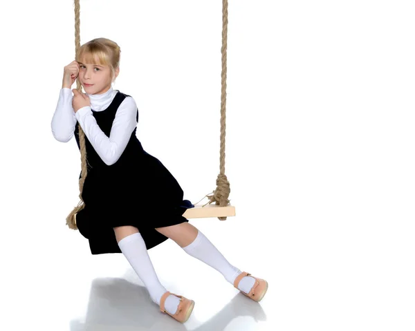 Little girl swinging on a swing — Stock Photo, Image