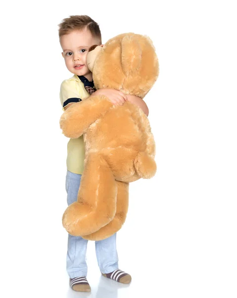 Little boy playing with teddy bear — Stock Photo, Image