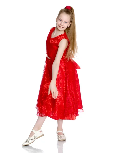 Elegante meisje in een jurk. — Stockfoto