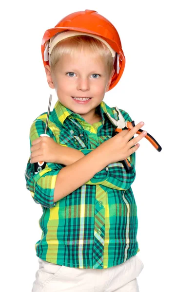 O menino no capacete do construtor . — Fotografia de Stock