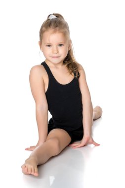 Kız jimnastikçi sicim egzersizi yapıyor..