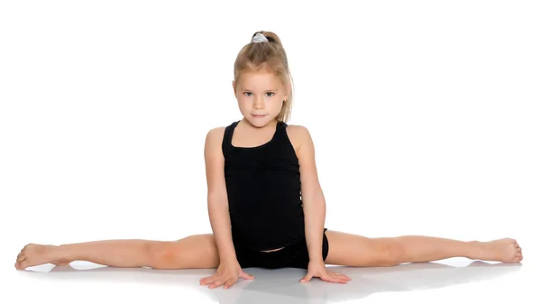 Girl gymnast perform the twine exercise. — Stock Photo, Image