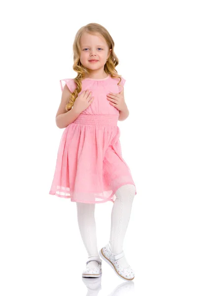 A cheerful little girl is dancing. — Stock Photo, Image