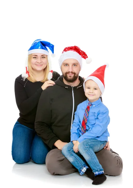 Glückliche Familie am Weihnachtsbaum — Stockfoto