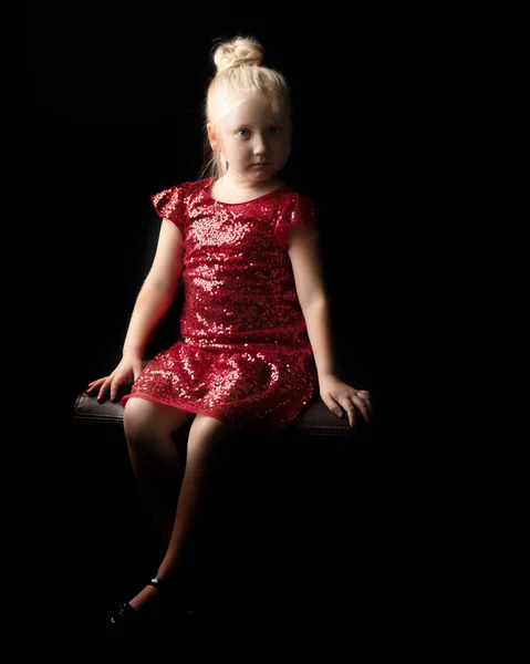 Little girl on a black background — Stock Photo, Image